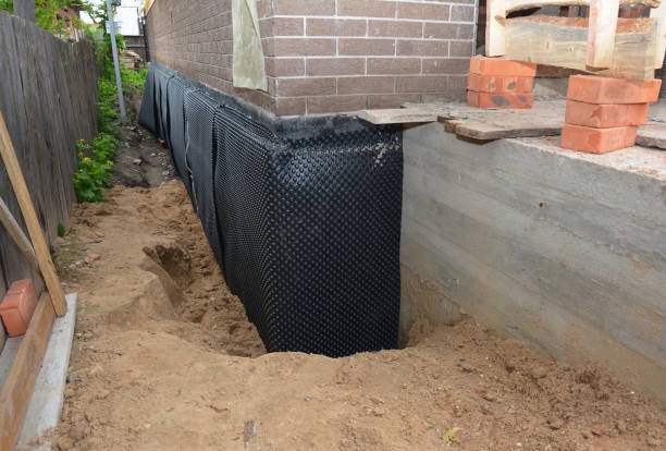 Happy homeowners after waterproofing job in Solon
